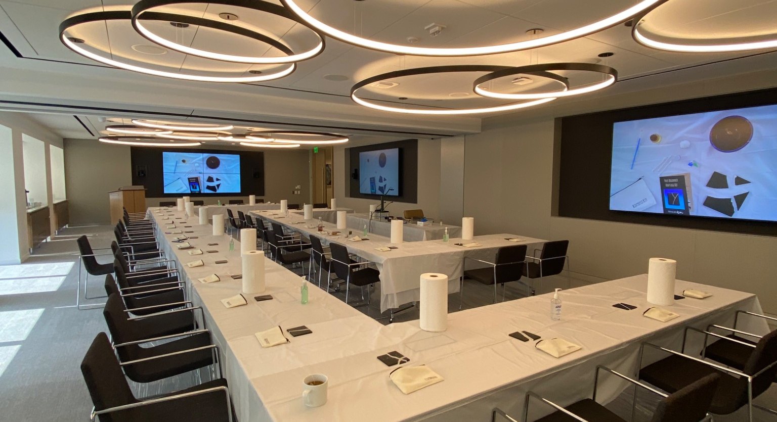 A workshop room set up with individual Kintsugi kits at each seat
